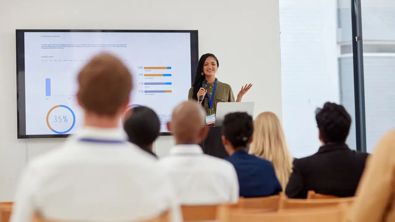 A female student presenting a report to an audience