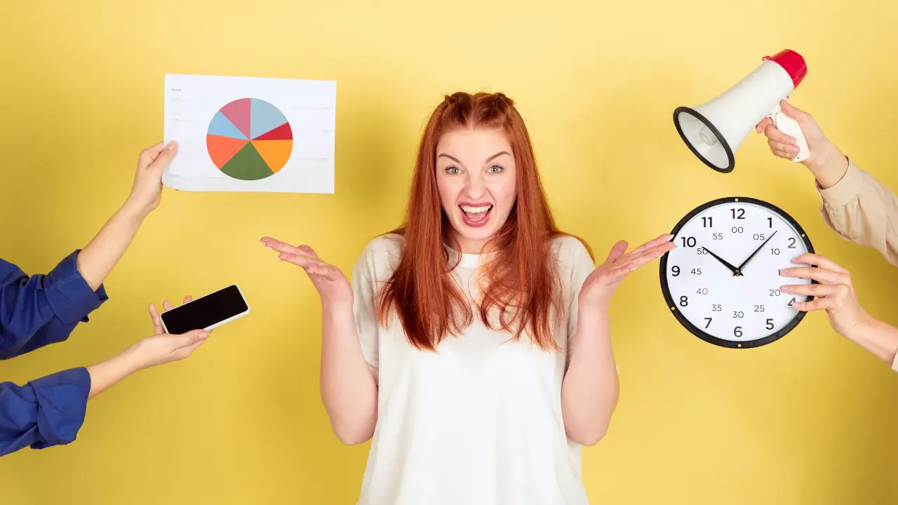 A woman bombarded with full schedules and having a hard time multitasking.