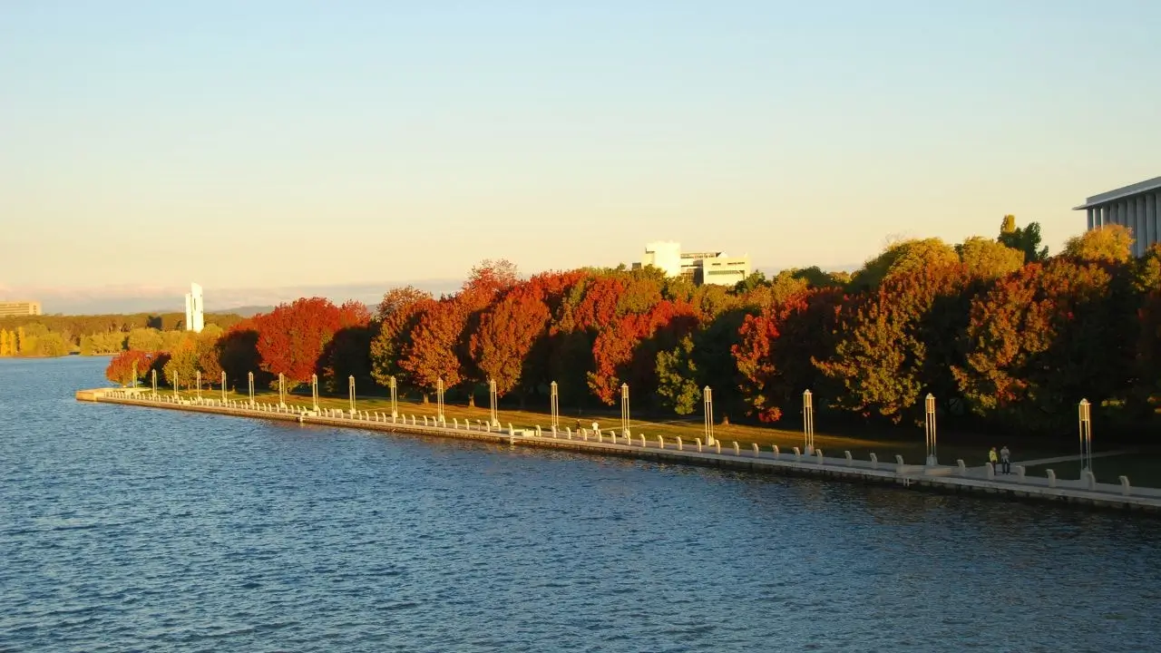 Autumn trees lining Lake Burley Griffin cycle paths, a popular route in the Australian Capital Territory