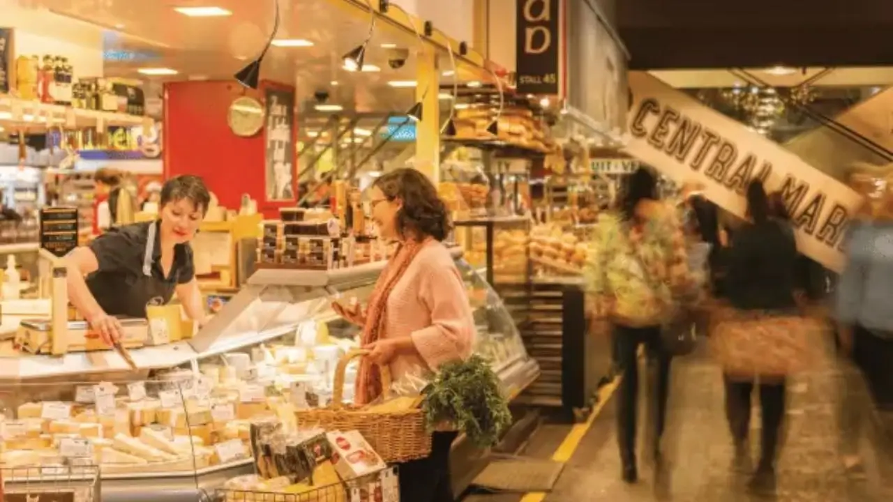 Bustling food court scene within Adelaide Central Market, showcasing the local gastronomic gateway.