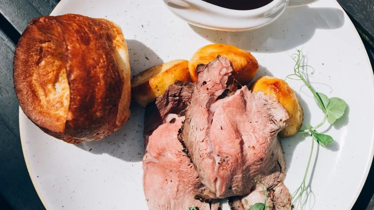 Classic plate of sunday roast meat and yorkshire pudding