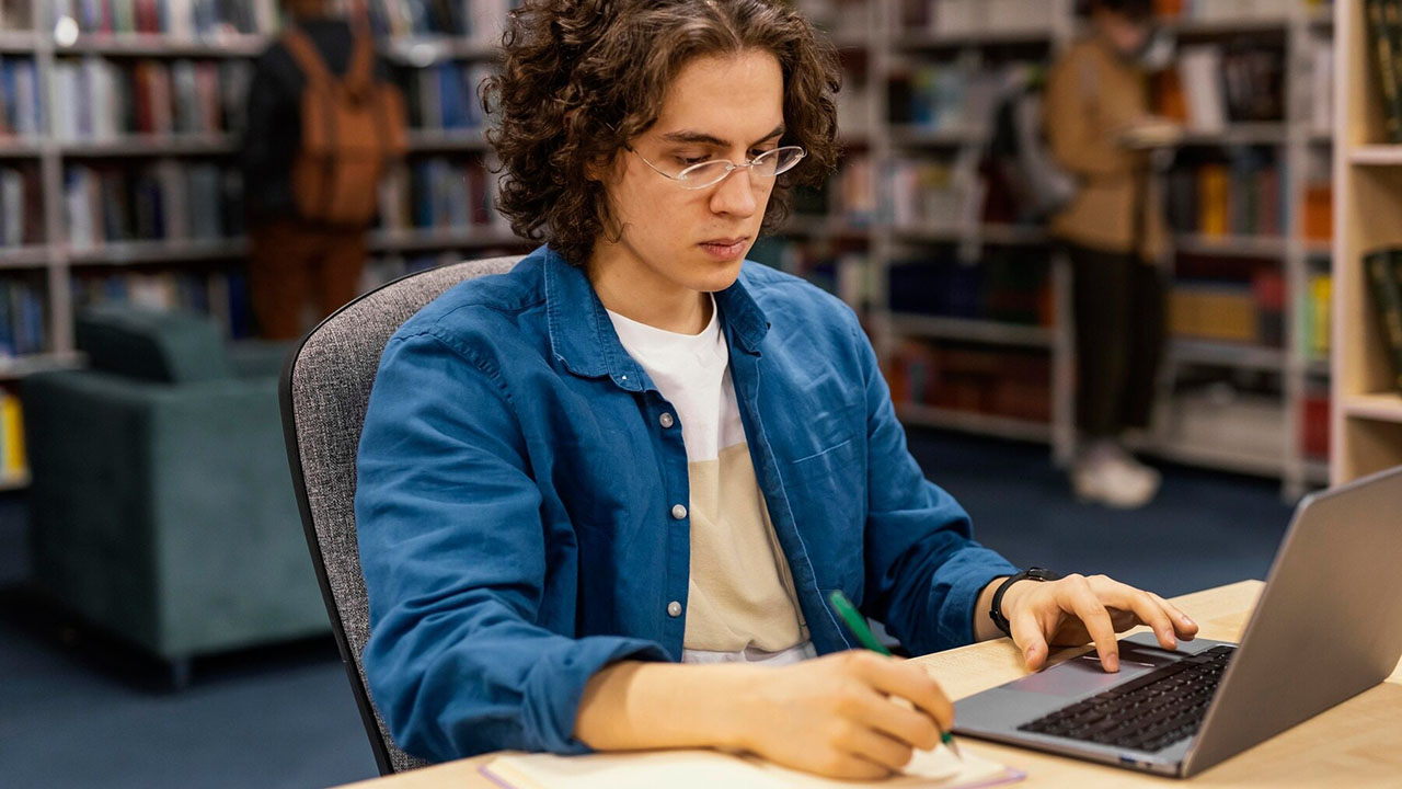 A man studying in a library